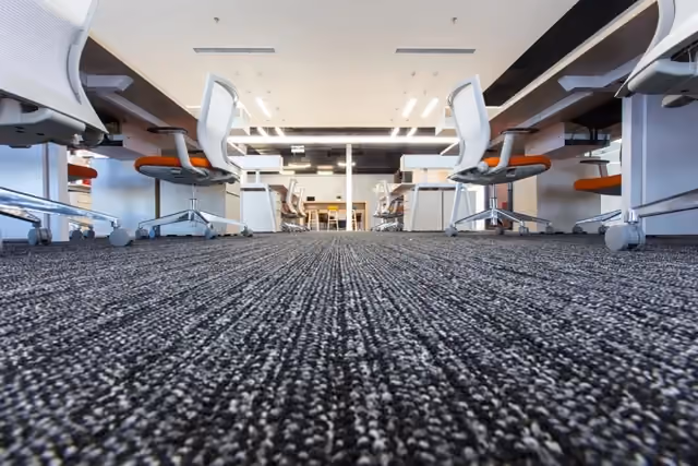 Commercial carpet cleaning technician cleaning office carpet in Lehigh Valley PA